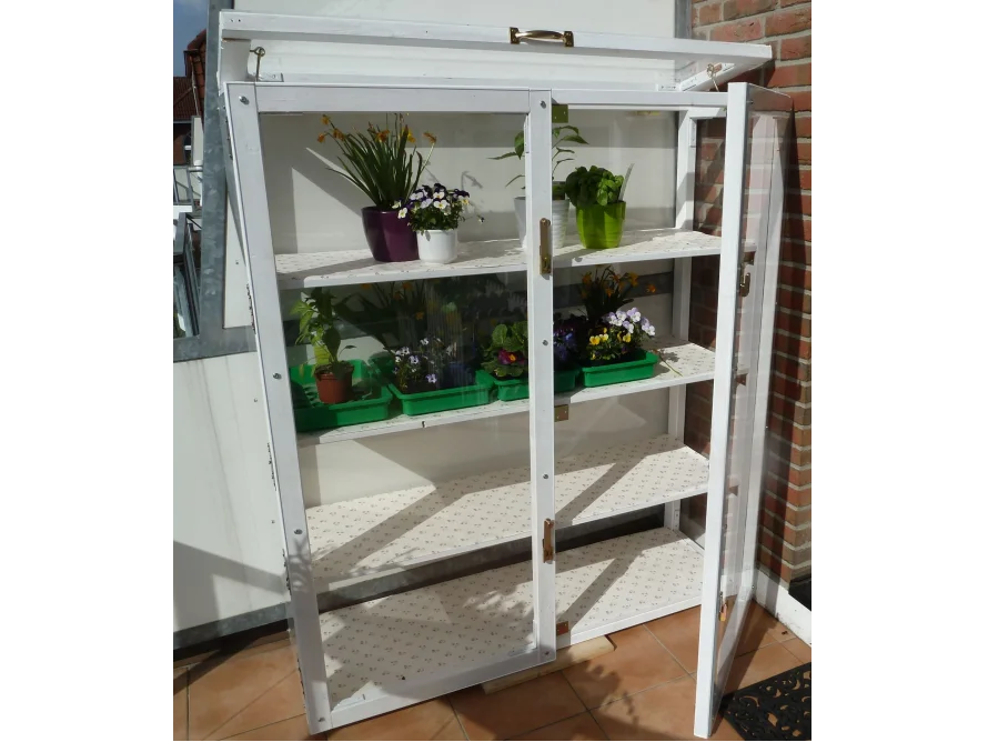Weißer Pflanzenschrank mit Glastüren