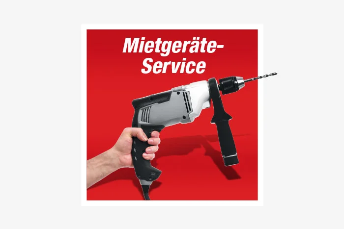 Hand hält Schlagbohrmaschine